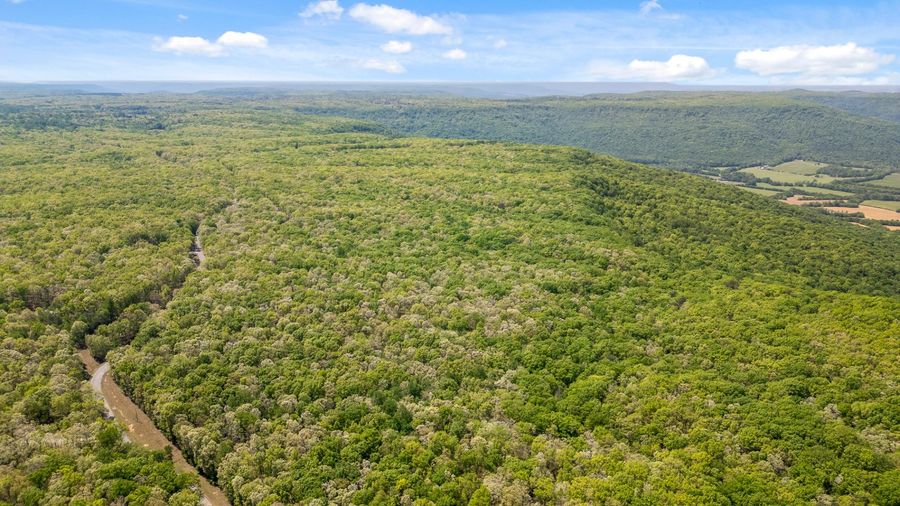Aerial view of The Oaks property with the valley beyond